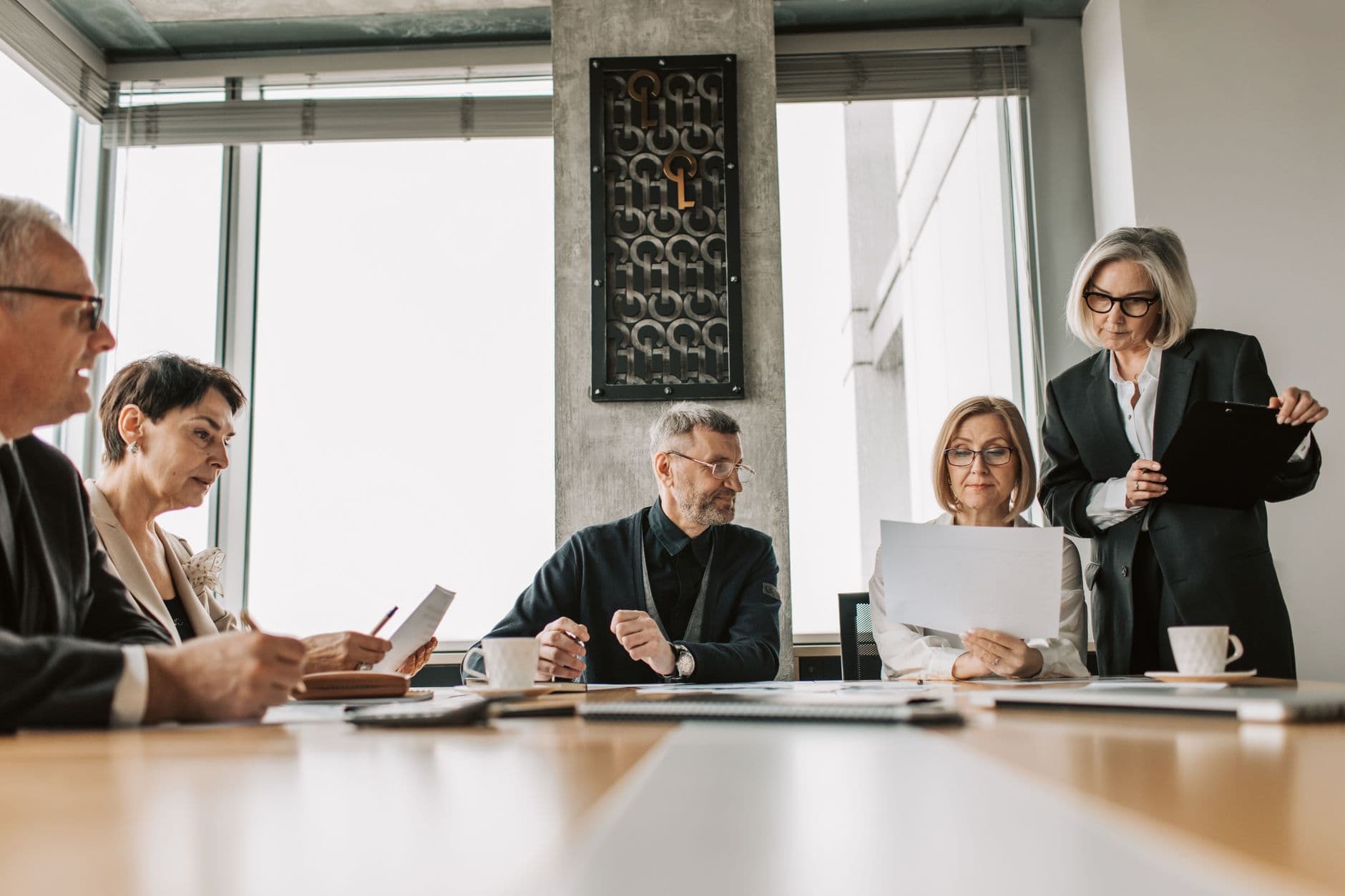 A board meeting around a conference table