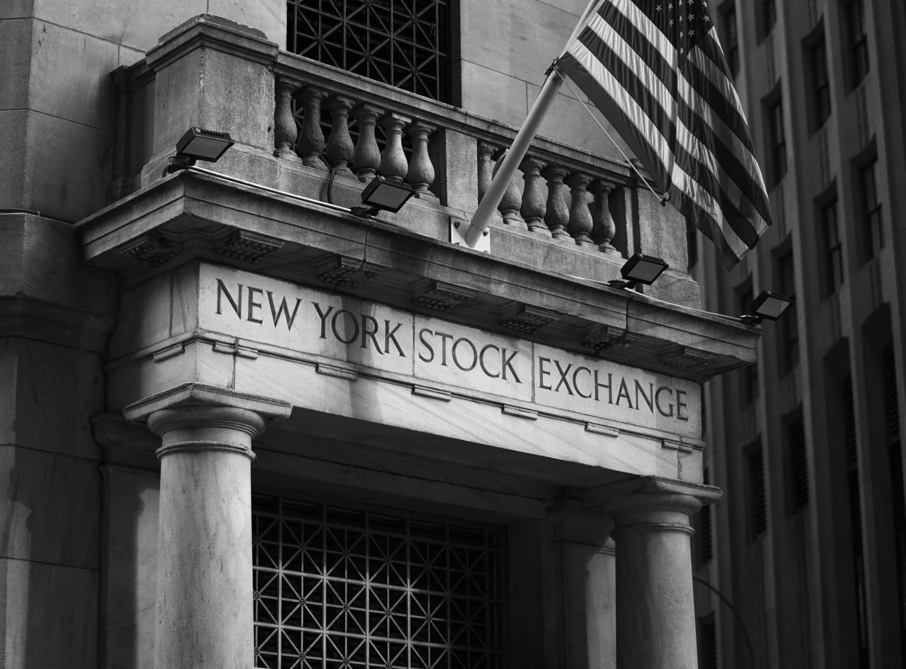 The New York Stock Exchange building on Wall Street, in black and white